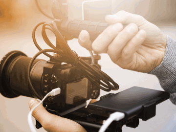 A filmmaker holding a camera