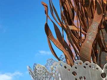 A metal sculpture in Ellenbrook against a clear blue sky