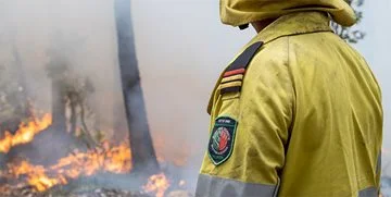 A volunteer firefighter doing a controlled burn
