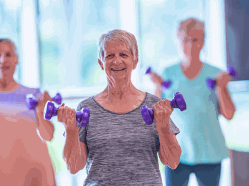 Seniors exercising with dumbbells