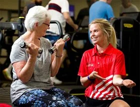 A senior works out with a Swan Active personal trainer