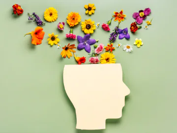 Art of open human head with flowers coming out