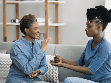 2 people communicating via sign language