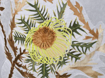 A flower embroidered onto a piece of fabric