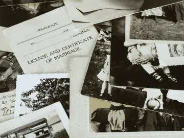 Black and white family photos and old legal documents