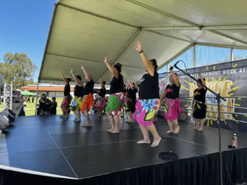 People hulaing on stage 