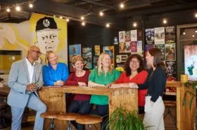 The Business Support team stood around a table for a lunch