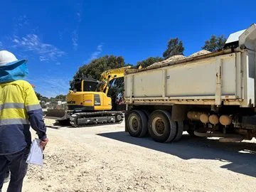 City of Swan staff supervise the safe use of an excavator and truck.