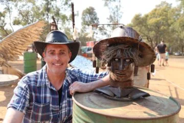Artist with his sculpture entered in the Australian Rustic Farm Art Awards.