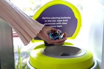Batteries being disposed in a disposal bin