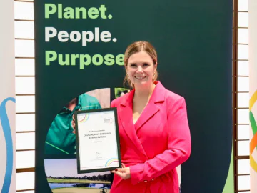 Kayla McNicol holding her award. 