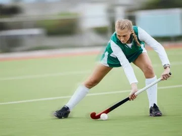 A woman playing hockey