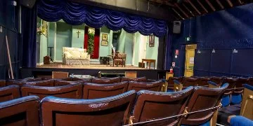 An internal view of Garrick Theatre showing seating and the stage