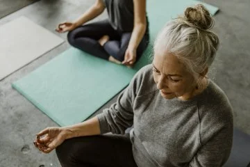 People meditating in a yoga class