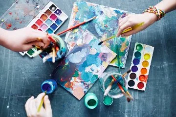 A mess of watercolour paint on a palette