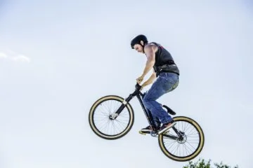 A man doing a jump on a BMX bike