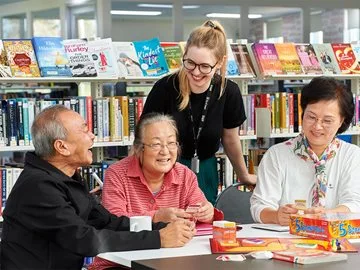A group of seniors attend a discussion group at Beechboro Library