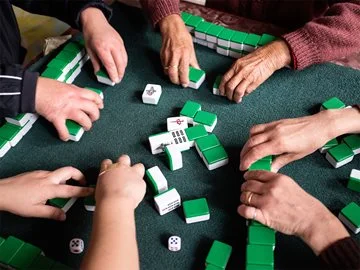 Four people playing mahjong