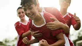 A soccer player celebrates a goal