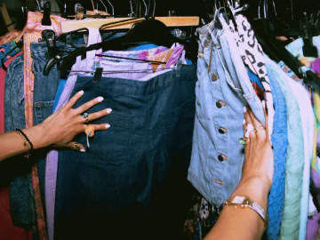 an image of clothing hanging on racks