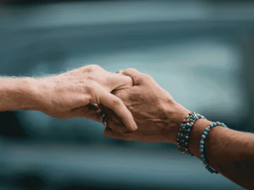 an image of two hands holding