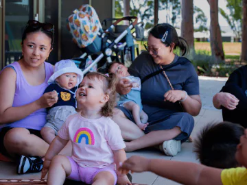 Families enjoying a play in the park session