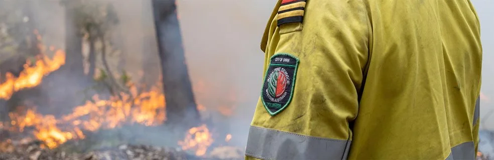 A volunteer firefighter doing a controlled burn