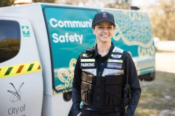 A Community safety ranger smiling at the camera