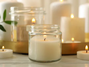 Several candles in jars