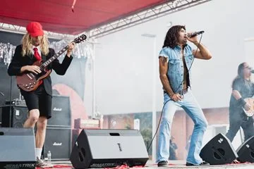 AC/DC tribute band performs on stage.