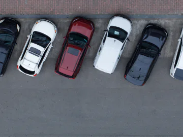 Cars parked incorrectly at the edge of the road